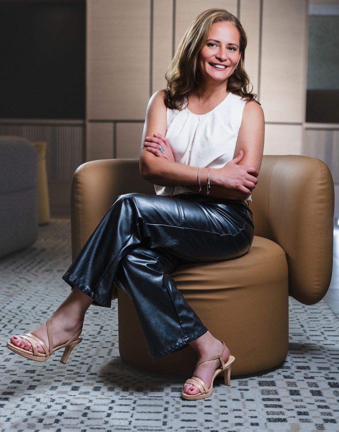 Maria Fernanda Crespo standing with a confident, professional posture